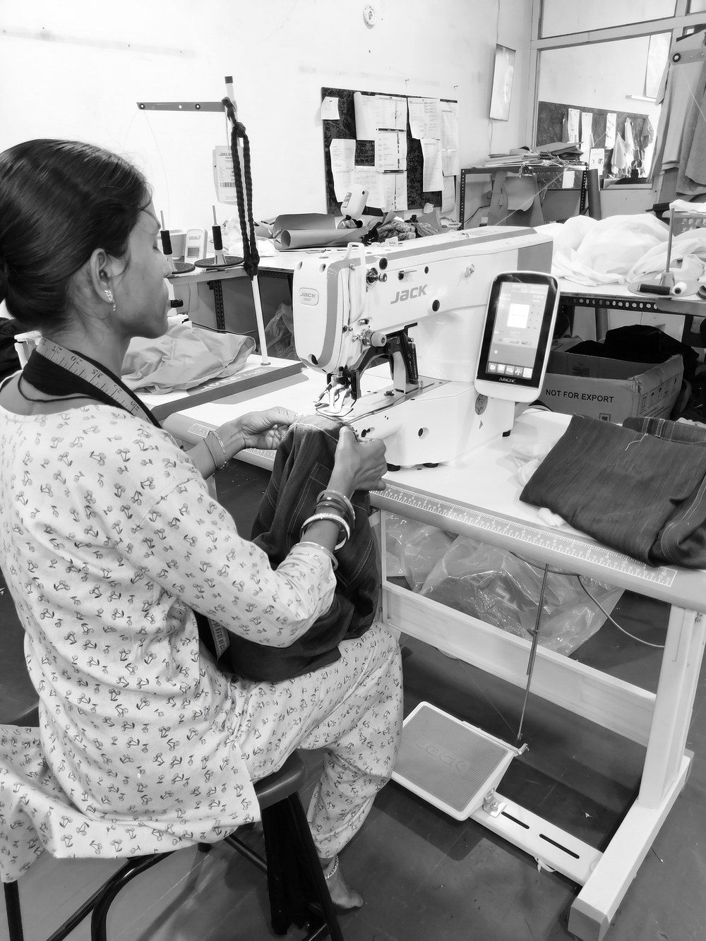Industrial sewing machine in operation