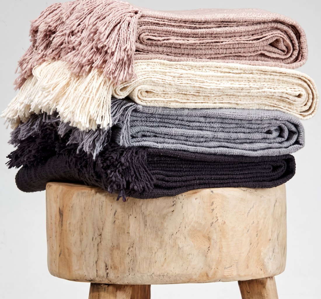 Stack of fringed throws